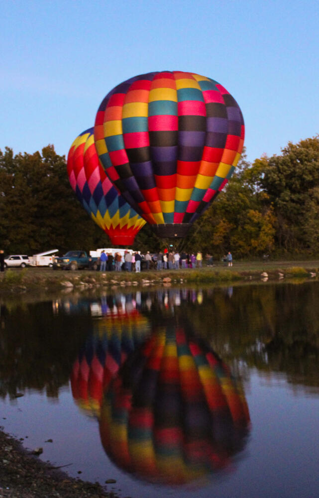 Two hot air balloons about to take off