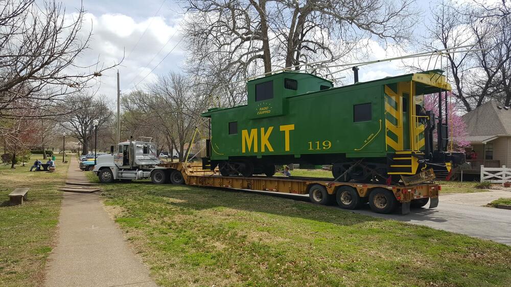 The green caboose arrives at its destination