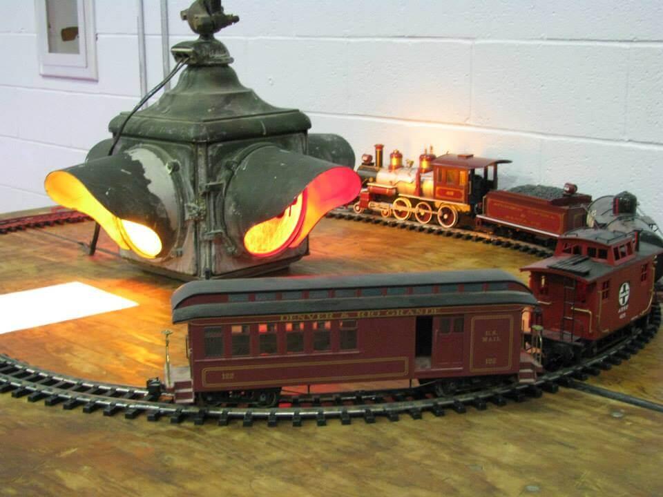 red model toy train on tracks