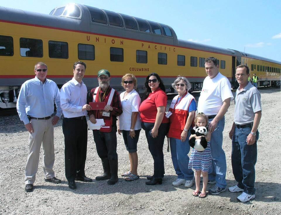 A group photo in front of the Union Pacific Columbine train
